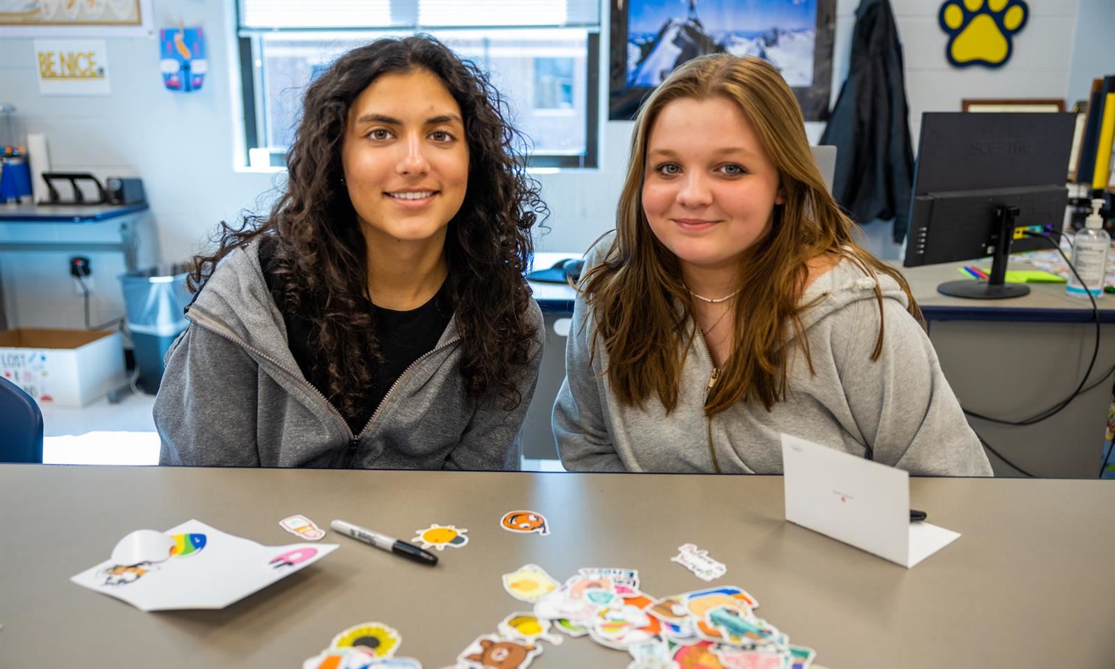 Two girls smile